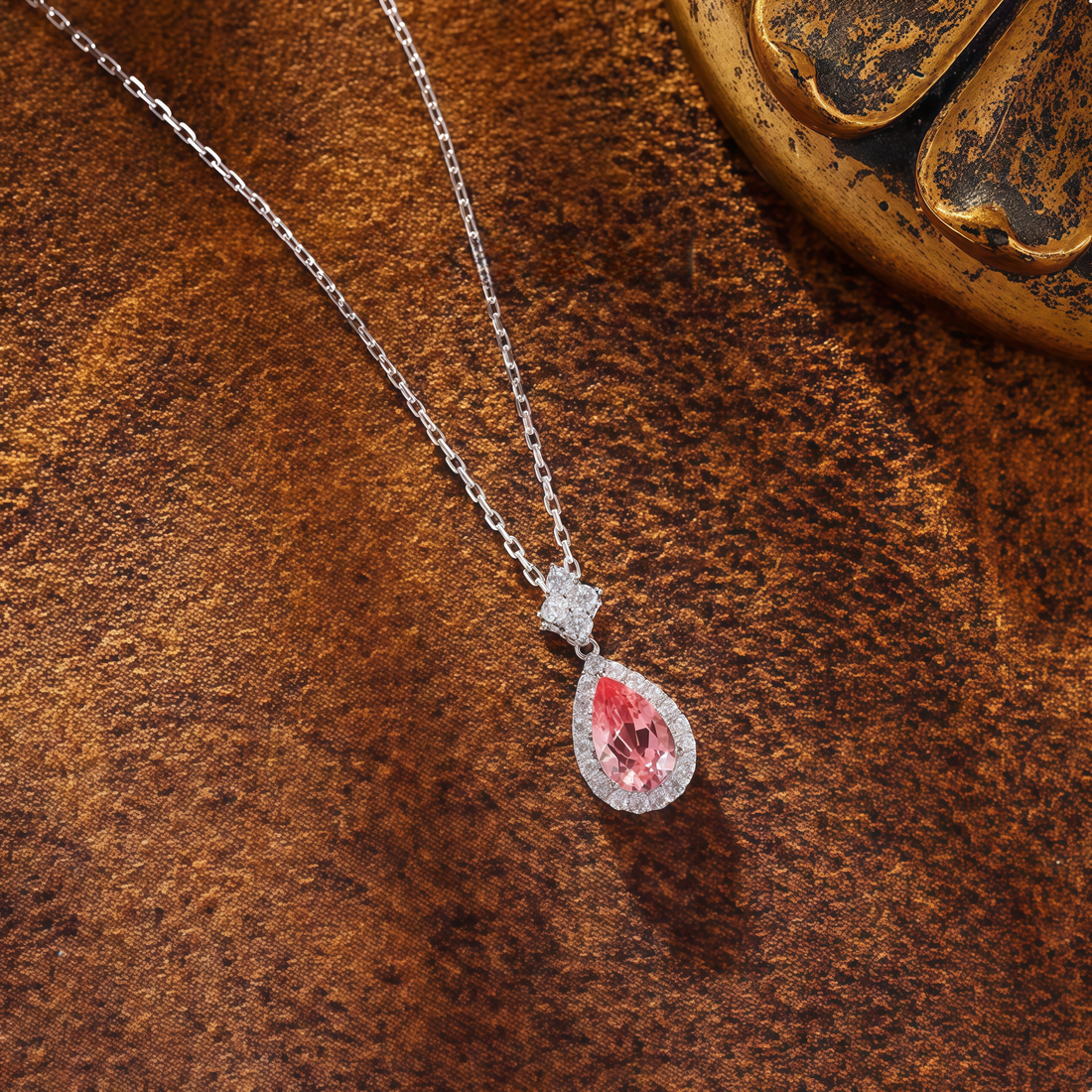Teardrop-shaped pink gemstone snowflake necklace