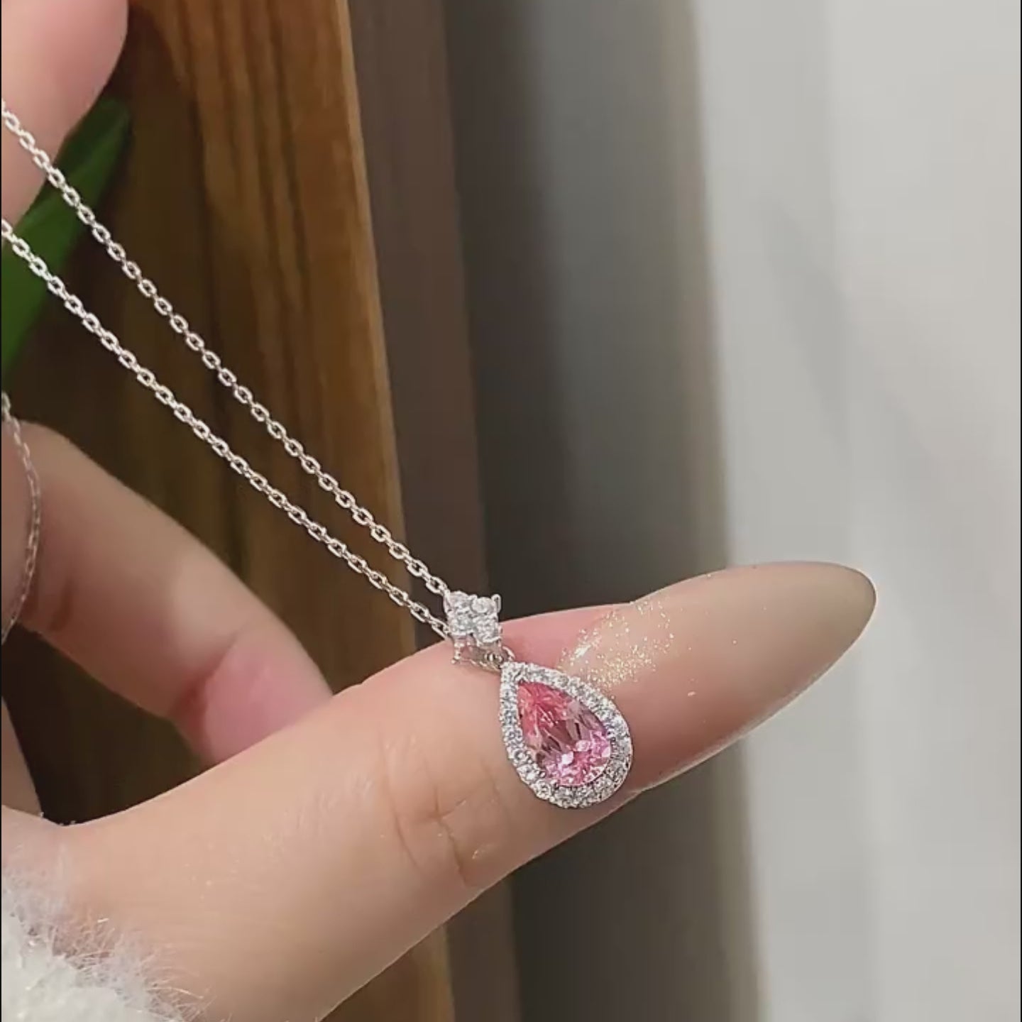 Teardrop-shaped pink gemstone snowflake necklace