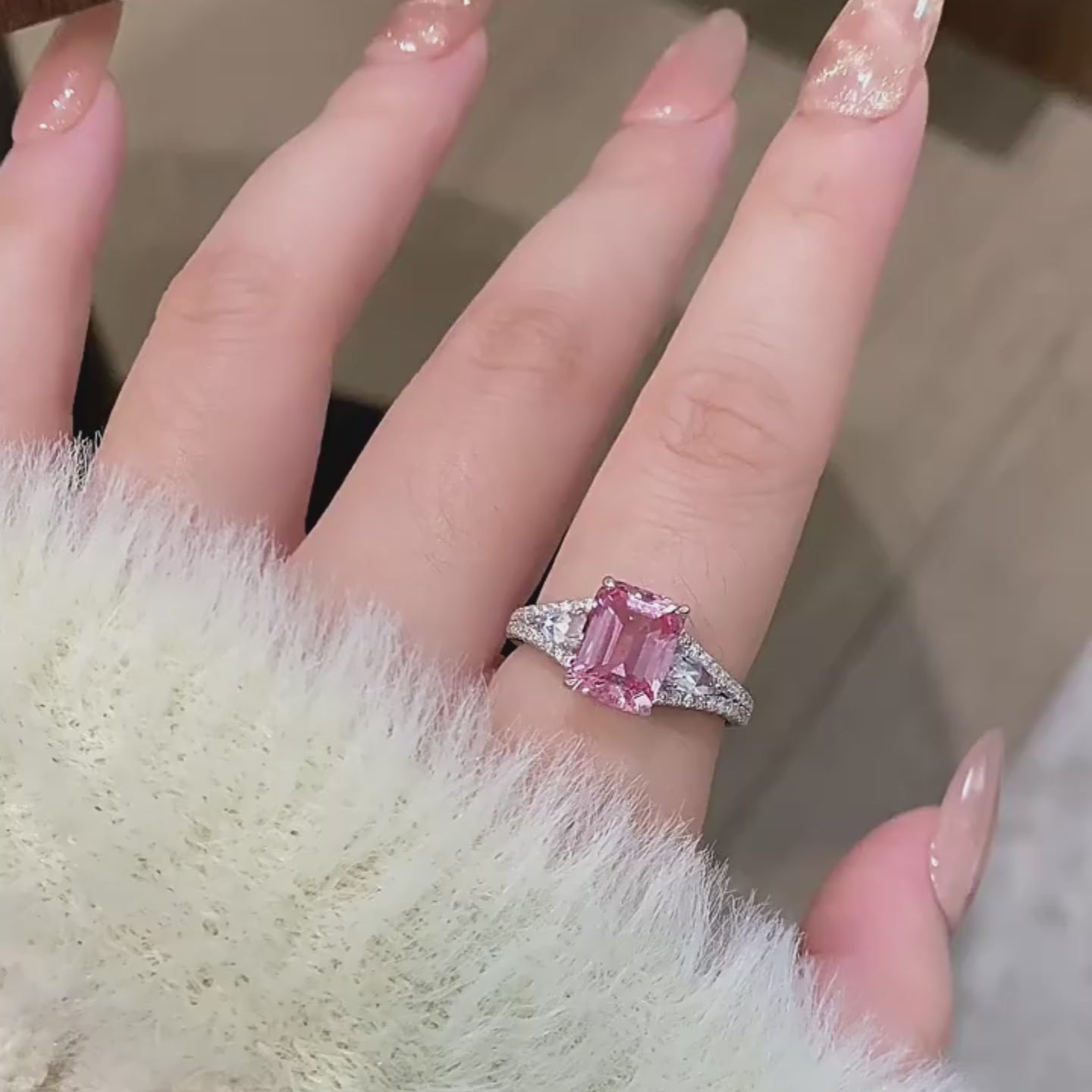 Pinkish-orange emerald-cut luxury ring